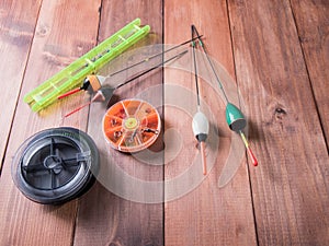 Spool of fishing line, floats and a box of hooks