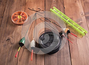 Spool of fishing line, floats and a box of hooks