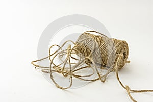 Spool of jute twine isolated on white background