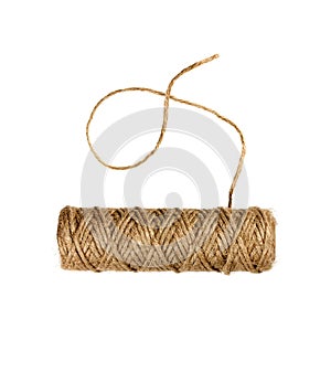 Spool of natural twine or rope isolated on white