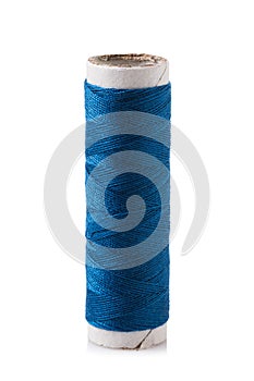 Spool of thread in blue isolated on white background