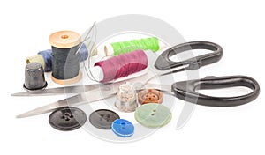 Spool of thread with buttons and scissors