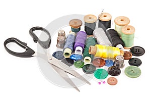 Spool of thread with buttons and scissors
