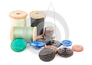 Spool of thread with buttons