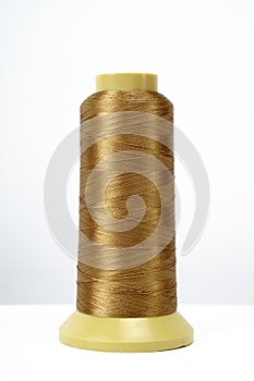 Spool of thread isolated on white background