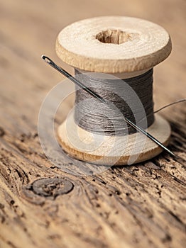 Spool of thread with a needle
