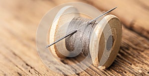 Spool of thread with a needle