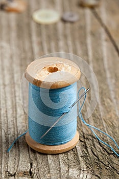 Spool of thread and needle