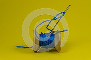 Spool of thread with needle