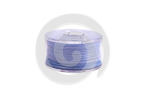 A spool of thread from a sewing machine on a white background isolated