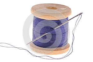 Spool of thread and sewing needle