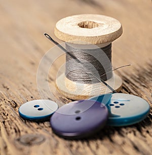 Spool of threads and buttons
