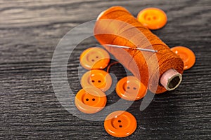 Spool of threads and buttons
