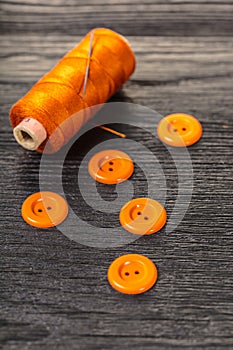 Spool of threads and buttons