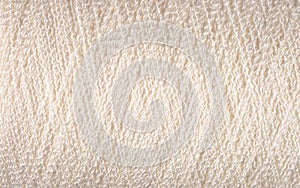 Spool of white thread macro background