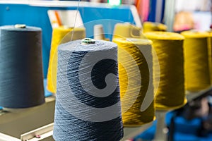 Spools of color threads closeup, sewing equipment