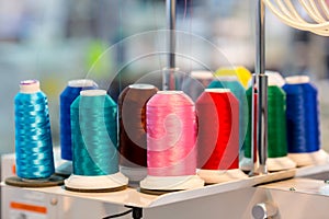 Spools of color threads closeup, sewing material