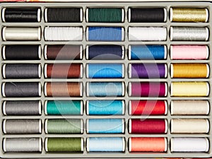 Spools with colored sewing thread