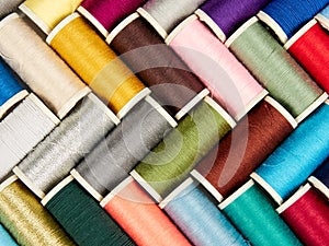 Spools with colored sewing thread