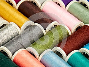 Spools with colored sewing thread