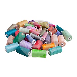 Spools of colorful thread on white background