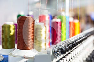 Spools of new threads closeup, sewing machine