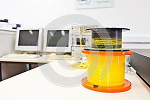 Spools of optic fiber cable on the desk