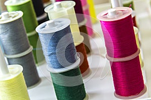 Spools of sewing thread of different colors