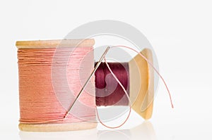 Spools of sewing thread with needle