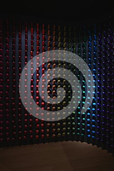 Spools of silk thread in gradient colors as a display in the exhibition.