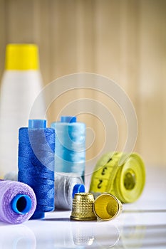 Spools and thimbles with measure tape