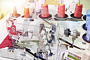 Spools of thread and sewing coverstitch machine