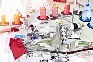 Spools of thread and sewing coverstitch machine