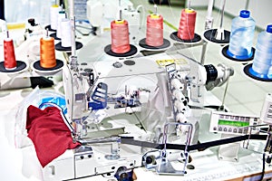 Spools of thread and sewing coverstitch machine
