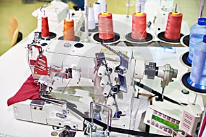 Spools of thread and sewing coverstitch machine