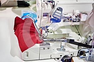 Spools of thread and sewing coverstitch machine