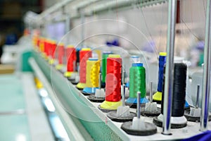 Spools of thread in the sewing equipment.