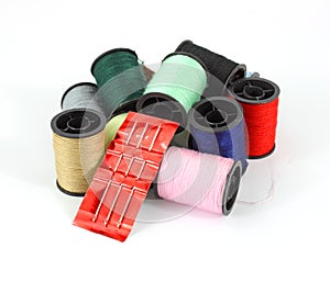 Spools of thread with a sewing needle