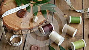 Spools of Thread with Sewing Needles, Thimble and Buttons