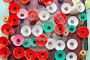 Spools of thread in a sewing workshop