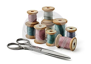Spools of thread in various pastel colors, including pink, green,