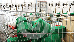 Spools of yarn thread in a basket. Yarn making processes. Threads production. Textile factory equipment. Textile factory