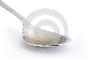 Spoon of apple cider vinegar