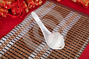 Spoon on bamboo mat and Tangyuan in spoon