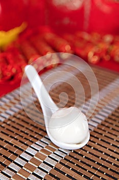 Spoon on bamboo mat and Tangyuan in spoon