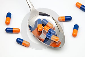 Spoon with capsulas medicas