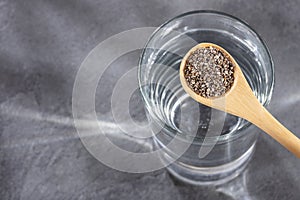 Spoon with chia seeds to mix with water - Salvia hispÃÂ¡nica photo