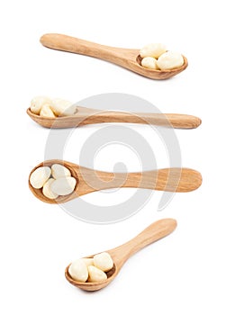 Spoon of chocolate candies isolated