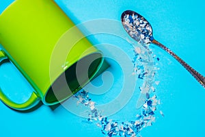 Spoon and cup with microplastics