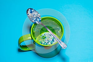 Spoon and cup with microplastics